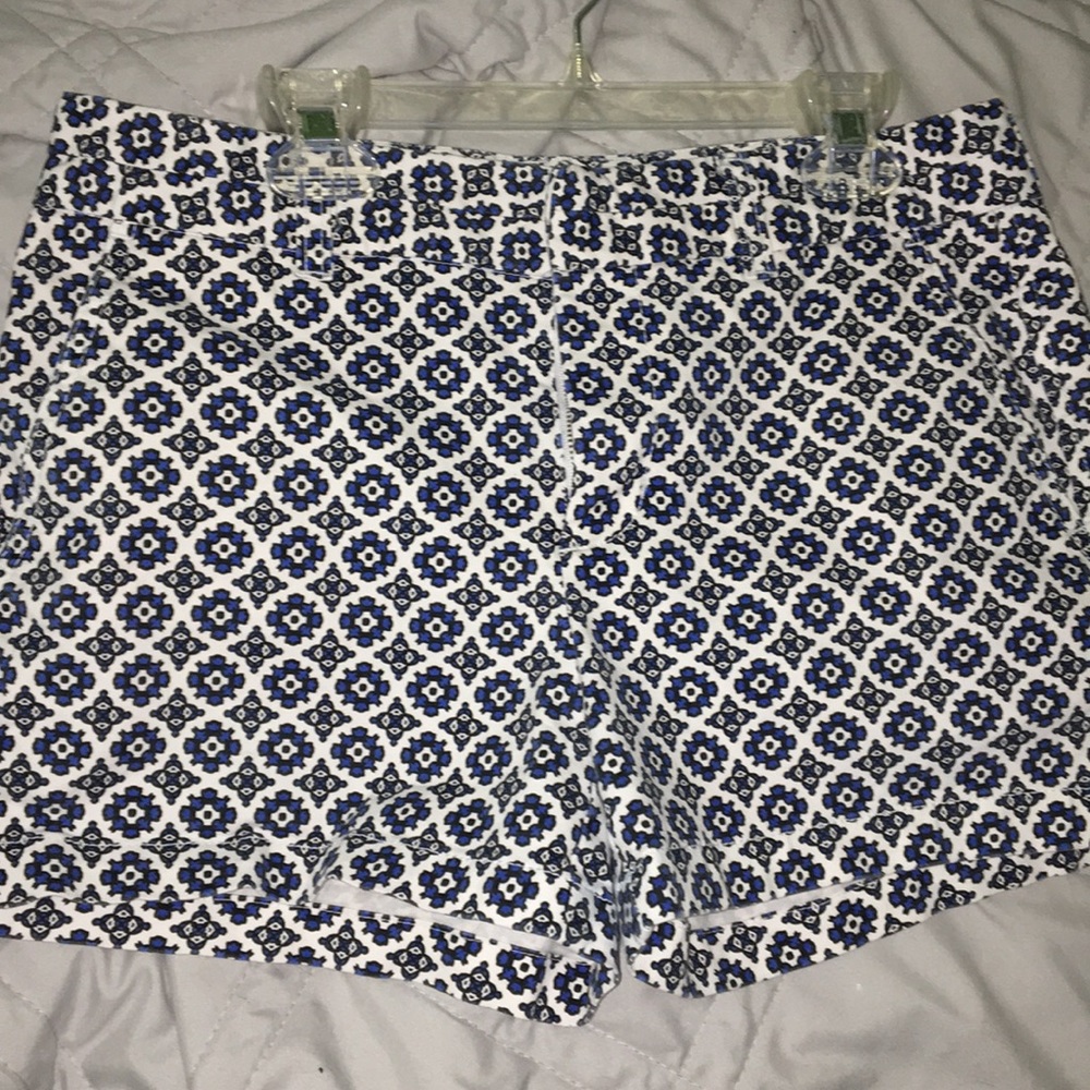white, black, & blue design shorts.